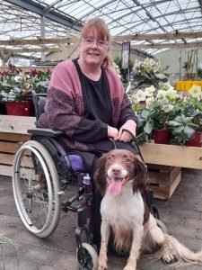 Suzanne Rowley in Wheelchair with her dog